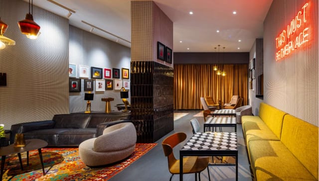 Rila Hotel meeting room with bistro tables and lounge seating for networking and small events.