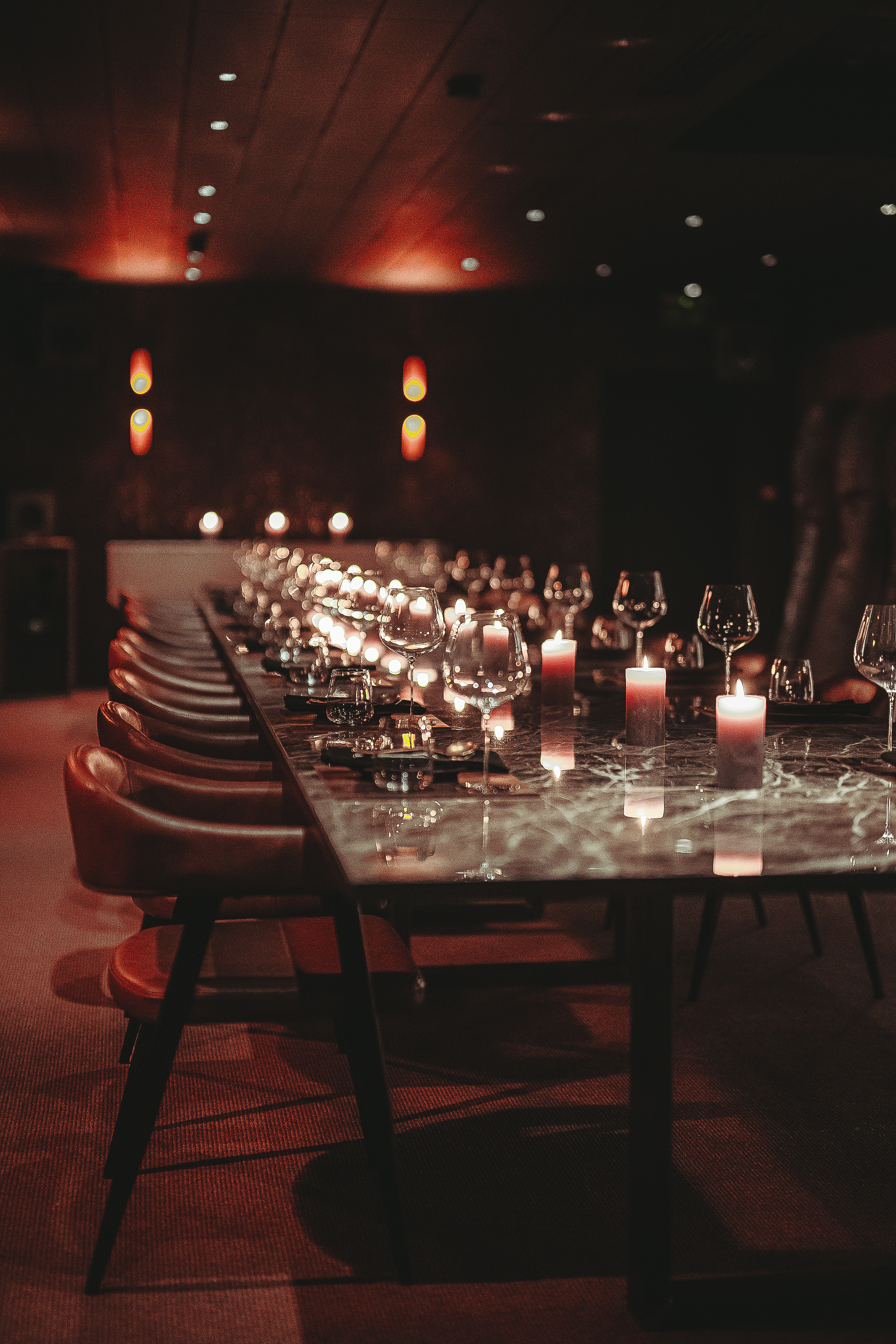 Elegant long-table setup at Etna in Hora for an exclusive executive dinner and private dining.