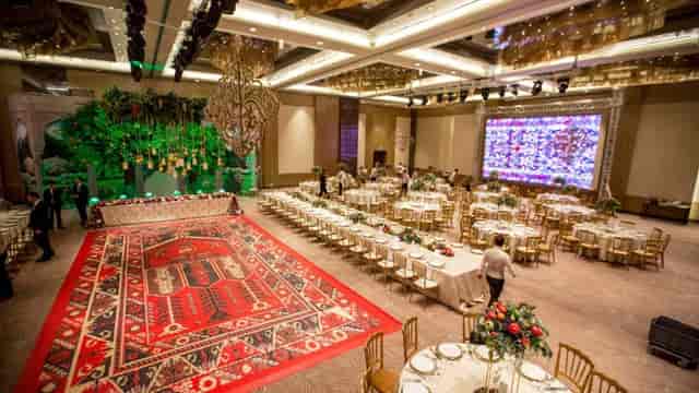 Luxury ballroom with patterned dance floor for wedding gala event venue.