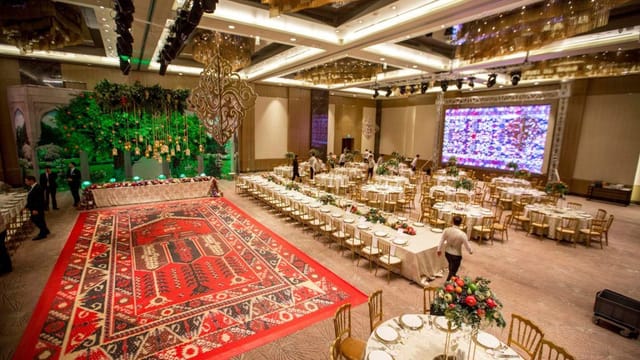 Luxury ballroom with patterned dance floor for wedding gala event venue.