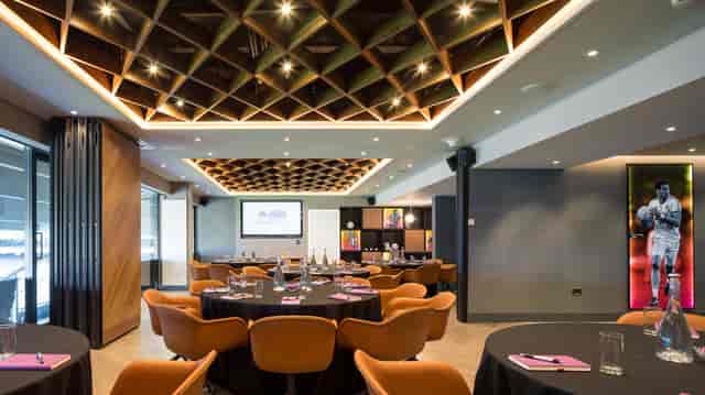 Modern meeting space at Croke Park with elegant round tables for corporate events.