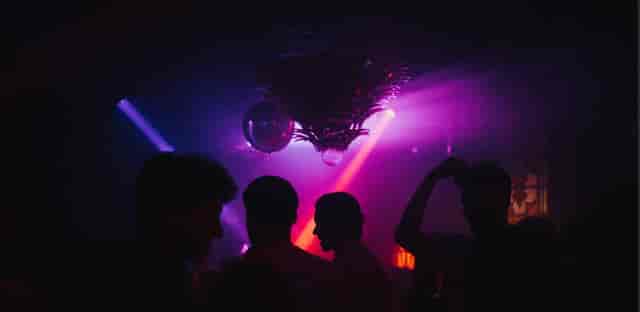 Vibrant event space at The Old Queen's Head with dynamic lighting for lively parties.