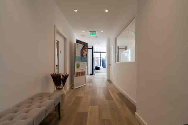 Minimalist CliniCity breakout hallway for professional high-end corporate event planning.