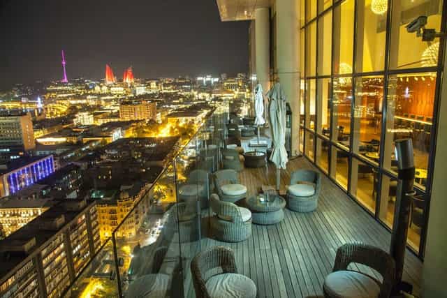 Rooftop venue at The Landmark Business Center with skyline views for VIP networking and cocktails.