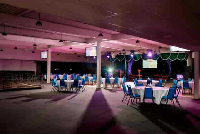 Pig & Whistle Butlin's Skegness gala dinner venue with stage lighting and banquet seating.