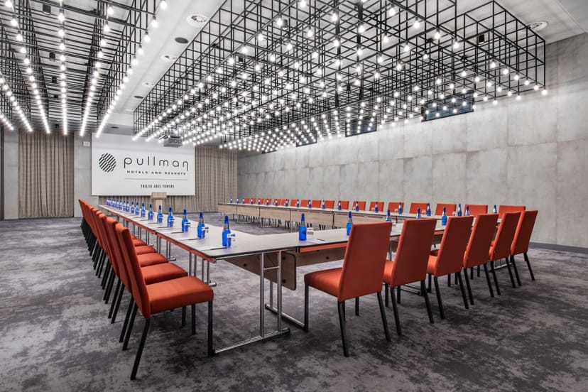 Modern U-shape boardroom setup at Pullman Tbilisi Axis Towers for strategy meetings and events.