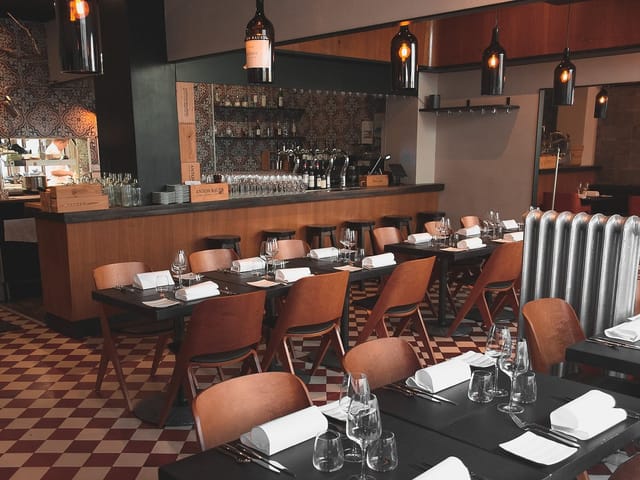 Restaurant Farang dining room, elegant setup for corporate luncheons and private dinners.
