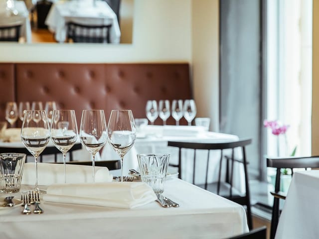 Restaurant Farang private dining setup with upscale booth seating for intimate events.