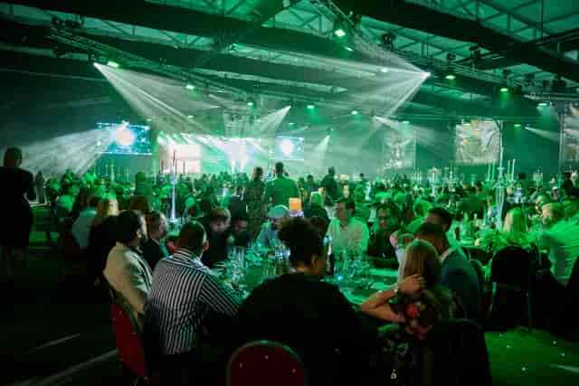 Studio 36 Butlin’s Minehead: Gala dinner stage with green lighting for corporate events.