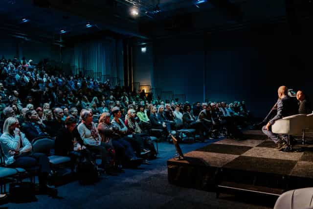Theater-style fireside chat at Kistamässan conference with a riser for a high-capacity audience.
