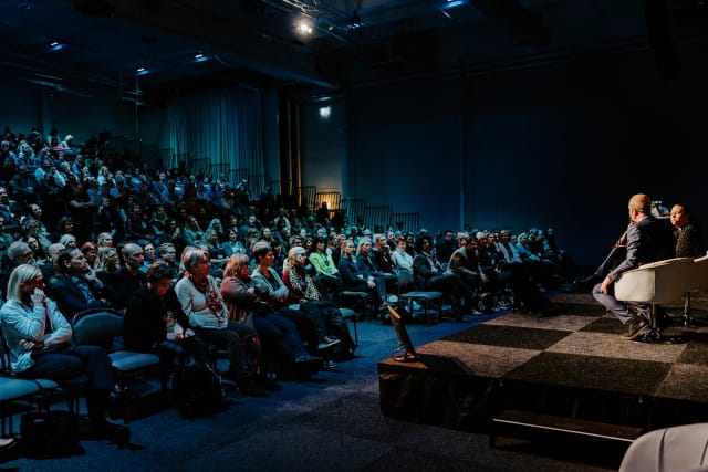 Theater-style fireside chat at Kistamässan conference with a riser for a high-capacity audience.