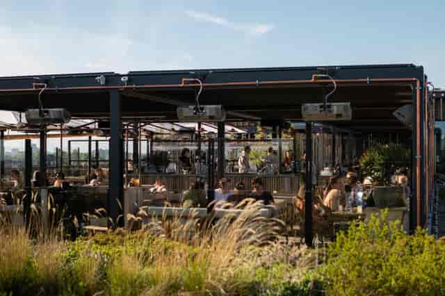 Rooftop beer garden venue at Tetto with climate control for cocktail receptions and networking.