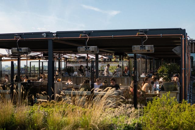 Rooftop beer garden venue at Tetto with climate control for cocktail receptions and networking.