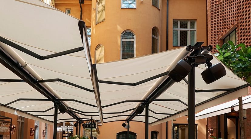 Hotel Villa Dagmar courtyard, versatile glass-roofed event space for networking and receptions.
