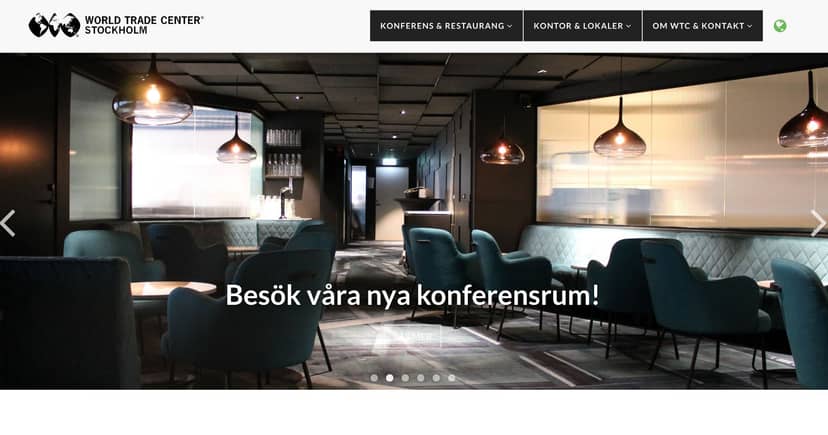Modern networking breakout area at World Trade Center Stockholm with sophisticated pendant lighting.
