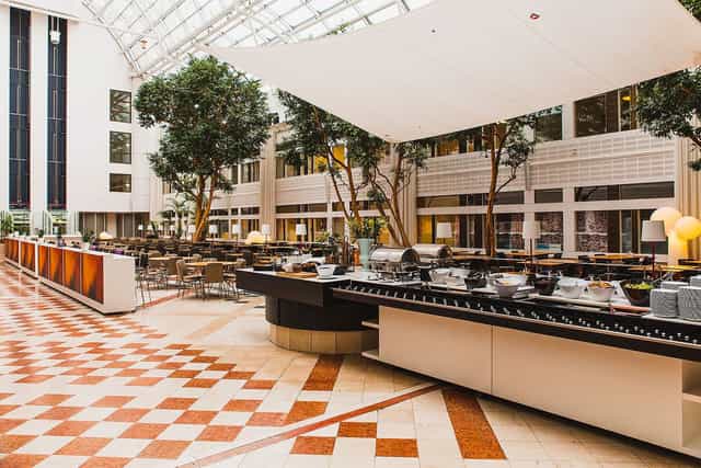 World Trade Center Stockholm atrium with buffet setup for large corporate events and conferences.
