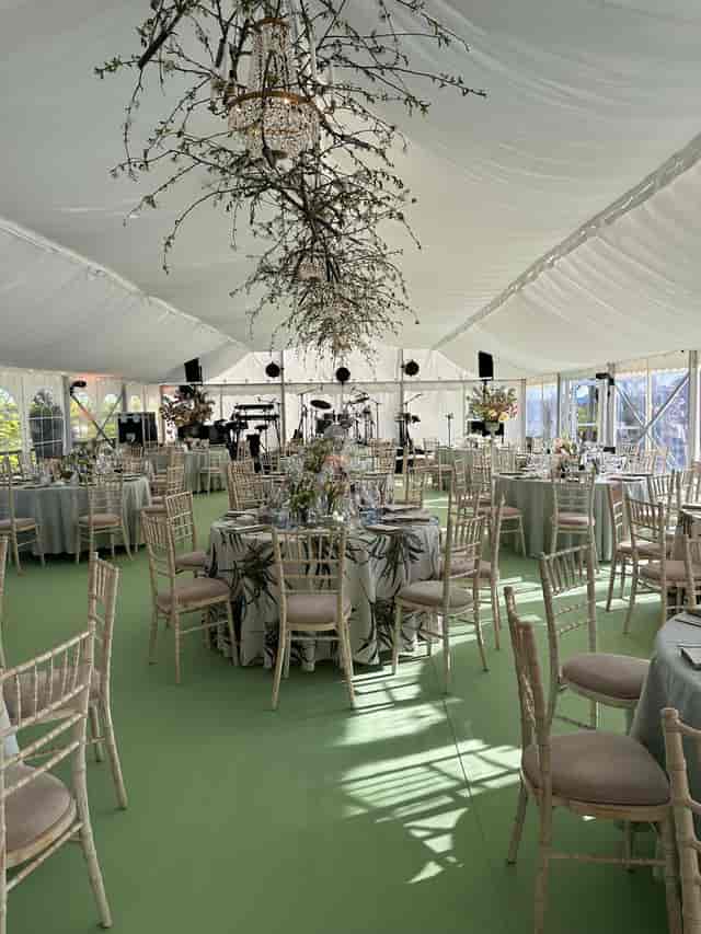 Main Hall event setup with floral ceiling installation, perfect for elegant weddings and galas.
