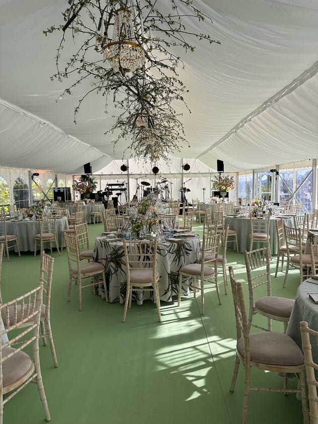 Main Hall event setup with floral ceiling installation, perfect for elegant weddings and galas.