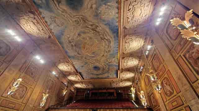 Grünewald Hall auditorium with ornate ceiling for gala events and keynote presentations.
