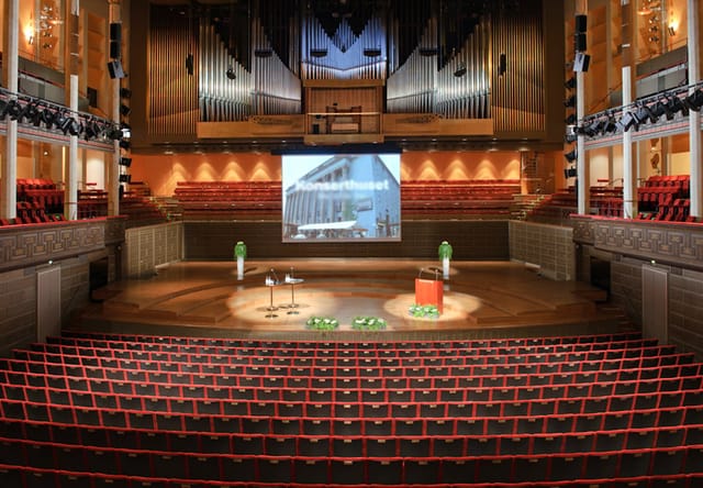 Stockholm Concert Hall keynote stage with professional lighting for corporate events.