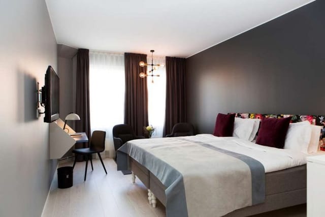 Elite Palace Hotel guest room with workspace for business travel and corporate event blocks.