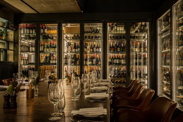 Pinnrummet private dining room with wine wall for VIP dinners and boardroom events.