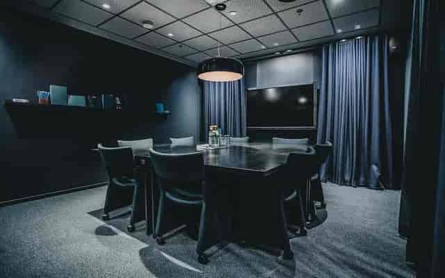 GT30 Lounge boardroom: high-contrast executive meeting room for corporate strategy sessions.