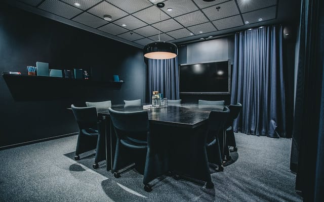 GT30 Lounge boardroom: high-contrast executive meeting room for corporate strategy sessions.