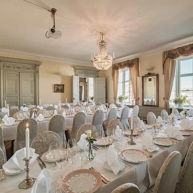 Classic gala dinner banquet setup at Van der Nootska Palatset with elegant architecture.