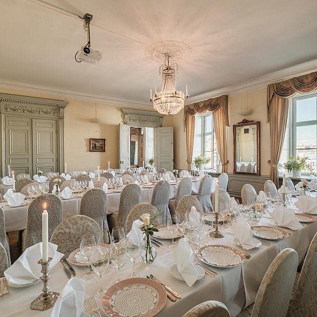 Classic gala dinner banquet setup at Van der Nootska Palatset with elegant architecture.