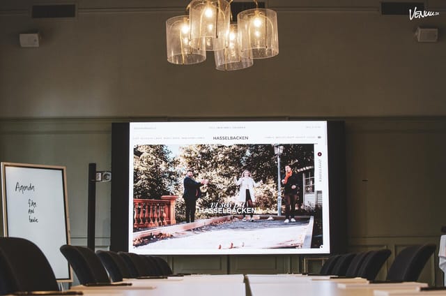 Hasselbacken boardroom with digital display for hybrid meetings and corporate events.