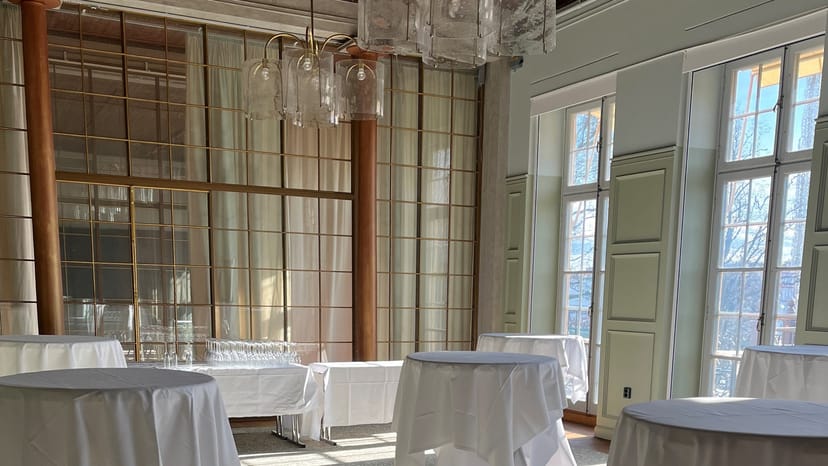 Elegant Hasselbacken banquet hall with high-top tables for corporate networking events.