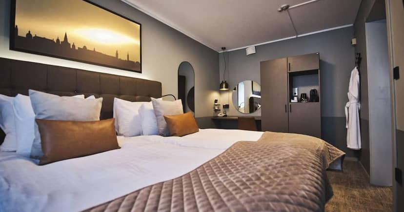 Modern conference hotel room with workspace for business travel events and corporate meetings.
