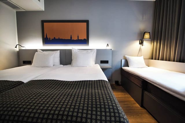 Hotel Birger Jarl triple room, functional guest accommodation for business conferences.