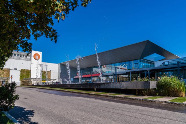Modern SIS Conference Centre facade for corporate exhibitions and large-scale trade shows.