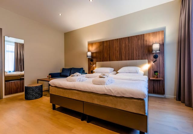 Best Western Karlaplan hotel room with desk for corporate business travel and workspace.