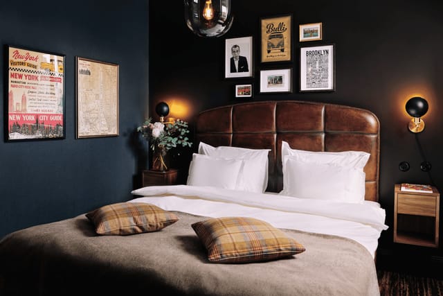 The Vault at NOFO Hotel: moody boutique guest room for VIP corporate retreats.