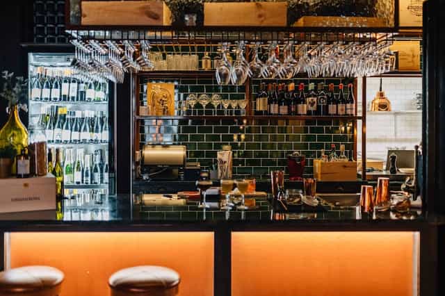 Club NOFO bar, atmospheric lighting, networking mixer venue, upscale evening social hour.