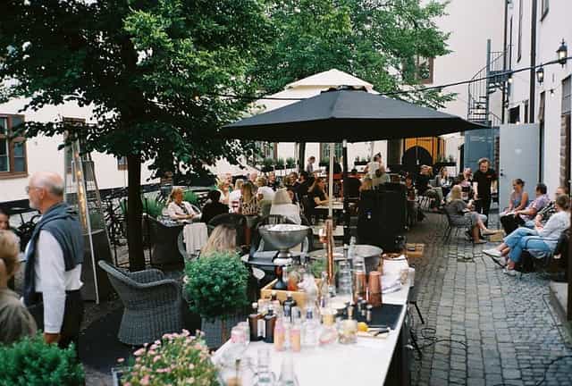 Intimate courtyard bar at NOFO Hotel, ideal for outdoor networking reception and corporate events.