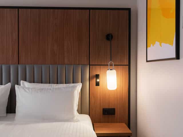 Modern upscale hotel room at voco Stockholm Kista, ideal for executive traveler room blocks.