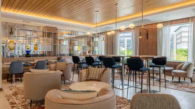 Voco Stockholm Kista breakout area with lounge seating for networking and corporate meetings.