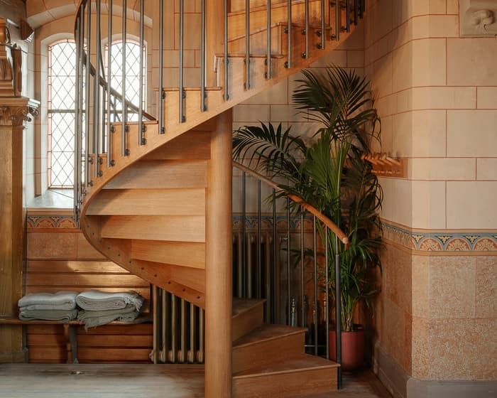 Spiral staircase at Soho House Stockholm, ADA accessibility challenge for event planning.