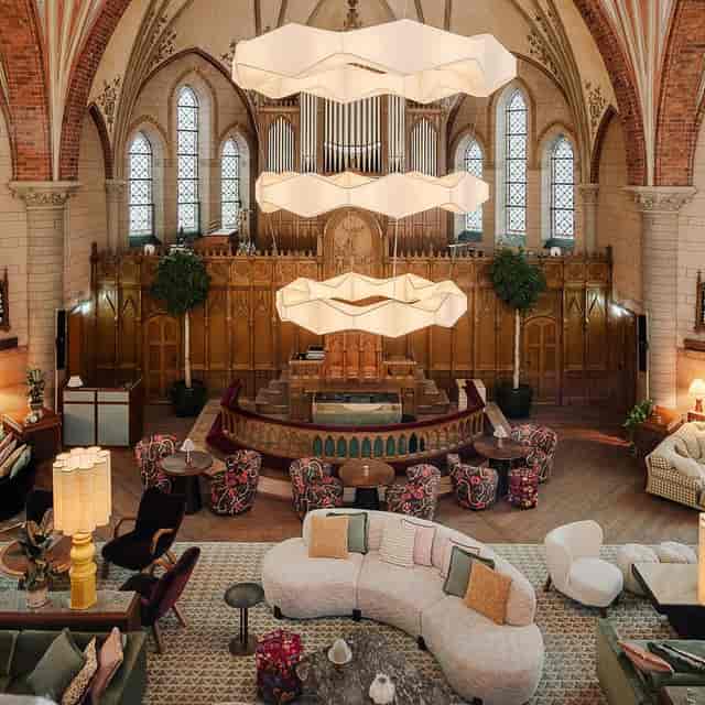 Soho House Stockholm lounge: historic venue featuring modern furniture for corporate events.
