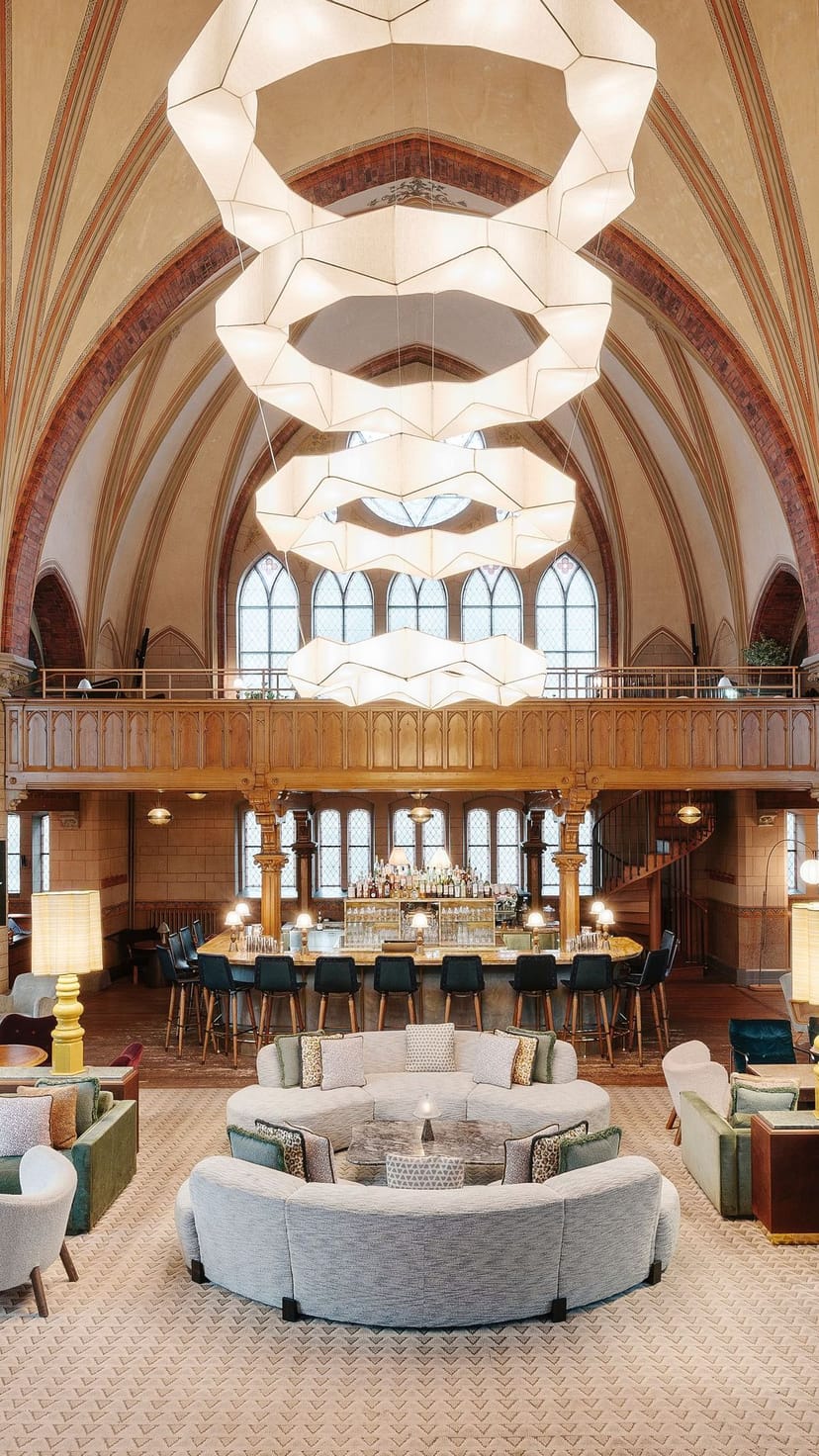 Mezzanine at Soho House Stockholm: Historic venue with dramatic lighting for cocktail receptions.