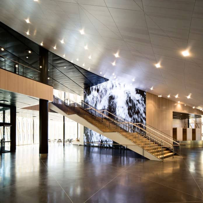 Erling Persson Hall foyer: contemporary space with digital backdrop for corporate event registration.