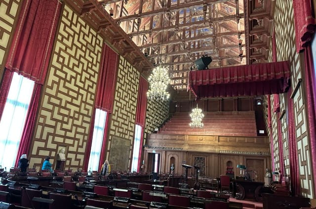 Historic Main Hall plenary venue with tiered seating for formal assemblies and conferences.