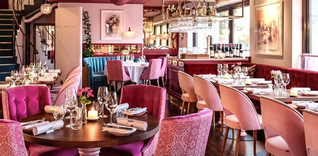 High-end 12th-floor restaurant with plush velvet seating for corporate dinners and networking events.