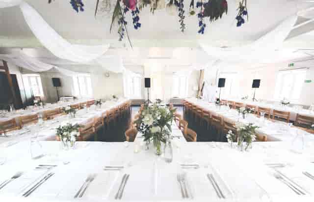 U-shaped banquet setup in Tackelkammaren, elegant event venue for corporate dining and conferences.