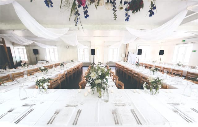 U-shaped banquet setup in Tackelkammaren, elegant event venue for corporate dining and conferences.