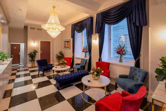 Hotel Gamla Stan lounge with crystal chandelier, ideal for luxury networking and corporate events.